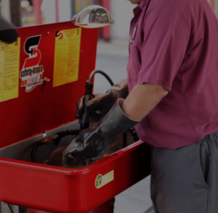 Man using parts washer